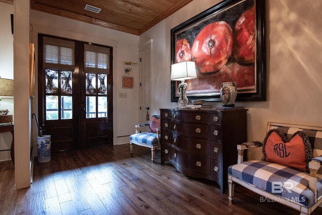 entrance foyer featuring wooden ceiling, dark hardwood / wood-style floors, ornamental molding, and french doors