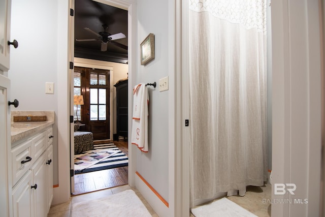 bathroom with tile patterned floors, ceiling fan, and vanity