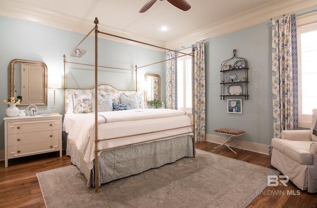 bedroom featuring multiple windows, dark hardwood / wood-style floors, and ceiling fan