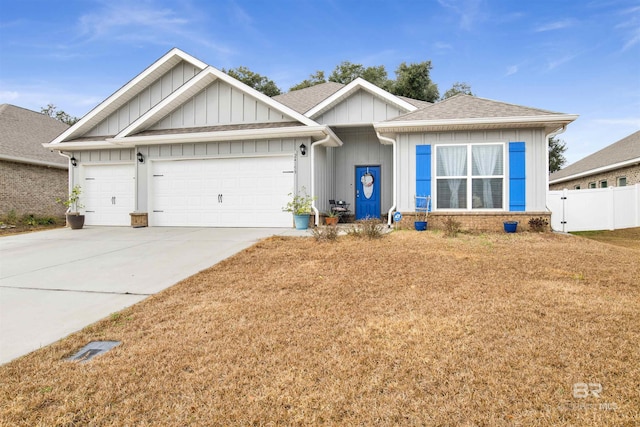 view of front of house with a garage and a front yard