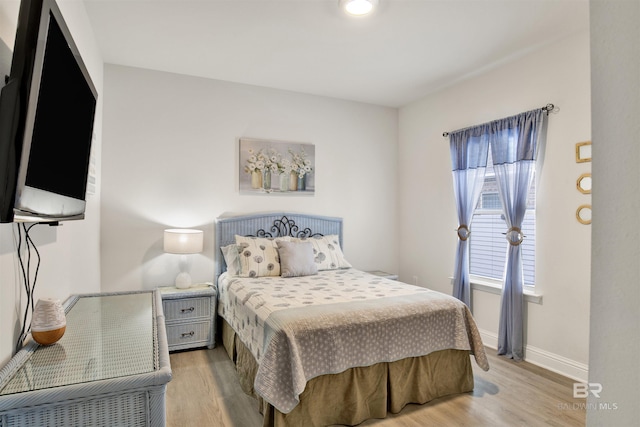 bedroom featuring hardwood / wood-style flooring