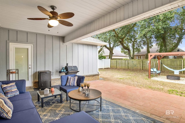 view of patio / terrace with ceiling fan, a fenced backyard, outdoor lounge area, and a grill