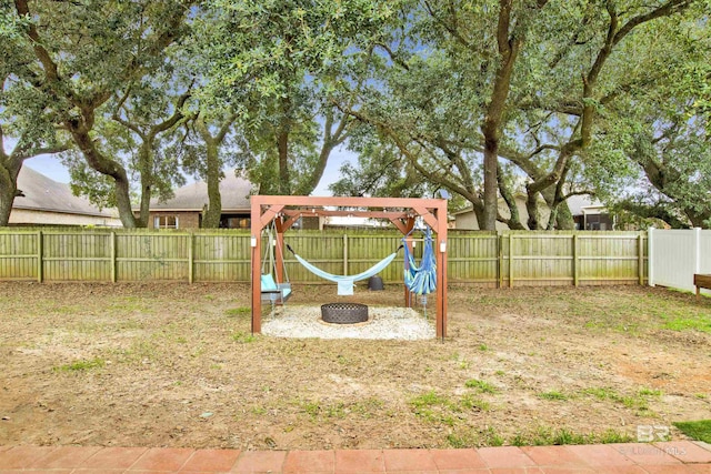 view of jungle gym with a fenced backyard