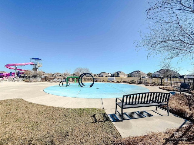 view of swimming pool with fence