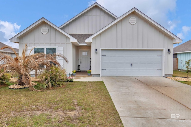 view of front of home featuring a garage, driveway, a shingled roof, board and batten siding, and a front yard