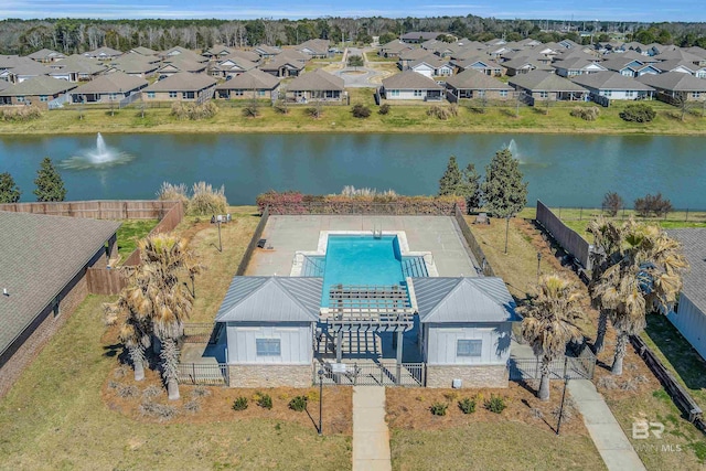 aerial view featuring a water view and a residential view