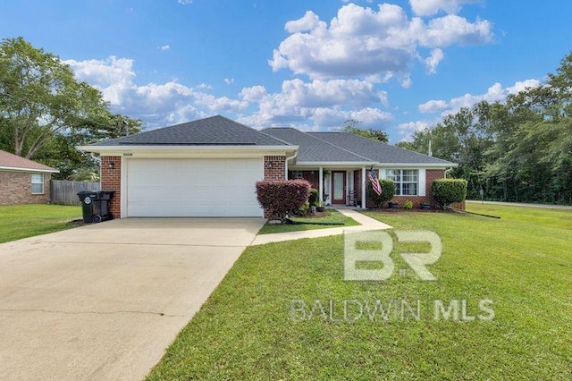23530 Arbor Creek Dr, Robertsdale, AL 36567 - ranch-style home with an attached garage, brick siding, and concrete driveway