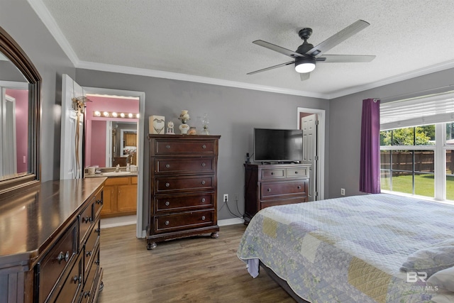 23530 Arbor Creek Dr, Robertsdale, AL 36567 - bedroom with a textured ceiling, a sink, wood finished floors, ornamental molding, and a ceiling fan