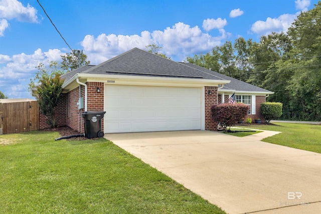 23530 Arbor Creek Dr, Robertsdale, AL 36567 - view of side of property with brick siding, an attached garage, and a shingled roof