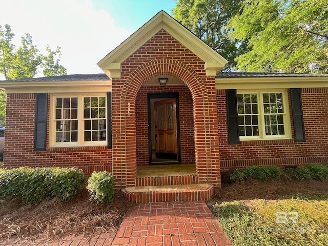 entrance to property with brick siding