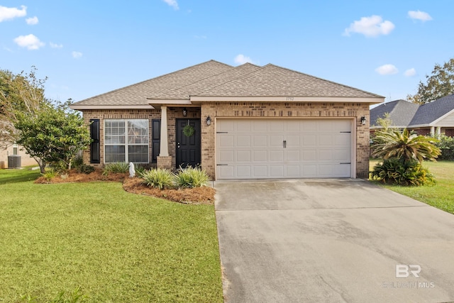 view of front of home featuring a front yard and a garage