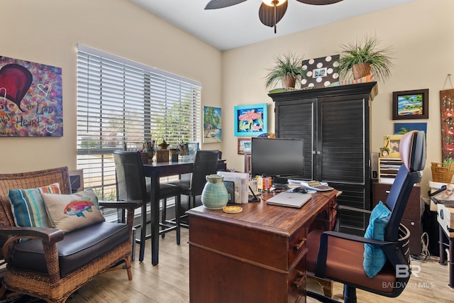 home office with ceiling fan and light hardwood / wood-style floors