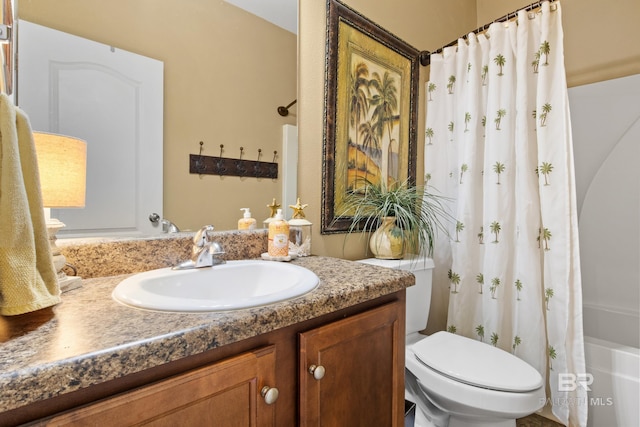 full bathroom featuring vanity, toilet, and shower / tub combo