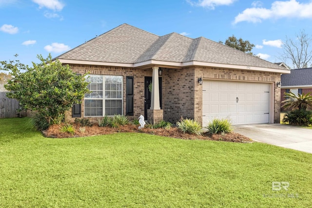 view of front of house with a garage and a front lawn