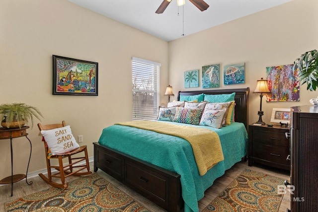 bedroom featuring ceiling fan and light hardwood / wood-style flooring