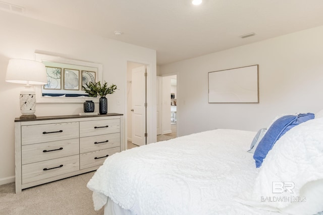 bedroom with light colored carpet