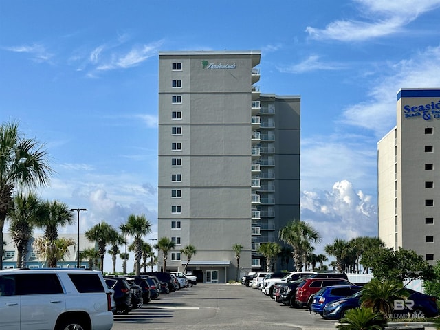 24568 Perdido Beach Blvd Unit 502, Orange Beach, AL 36561 - view of apartment building / complex featuring uncovered parking