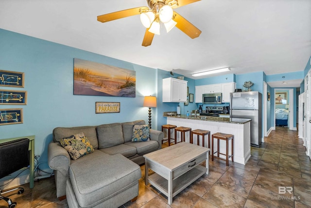 24568 Perdido Beach Blvd Unit 502, Orange Beach, AL 36561 - living area with a ceiling fan