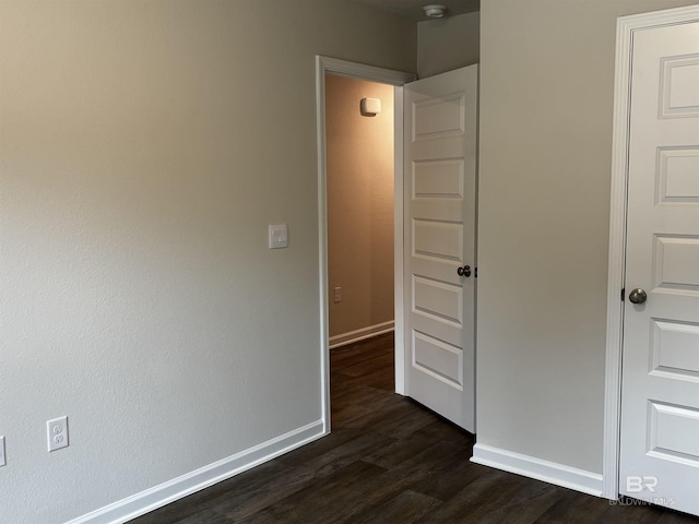 13710 Logan Pl, Foley, AL 36535 - unfurnished bedroom featuring dark wood-style floors and baseboards