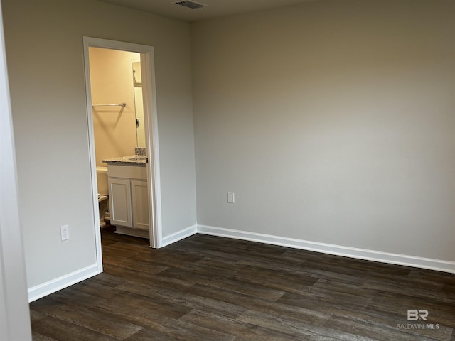 13710 Logan Pl, Foley, AL 36535 - spare room featuring dark wood-style floors and baseboards