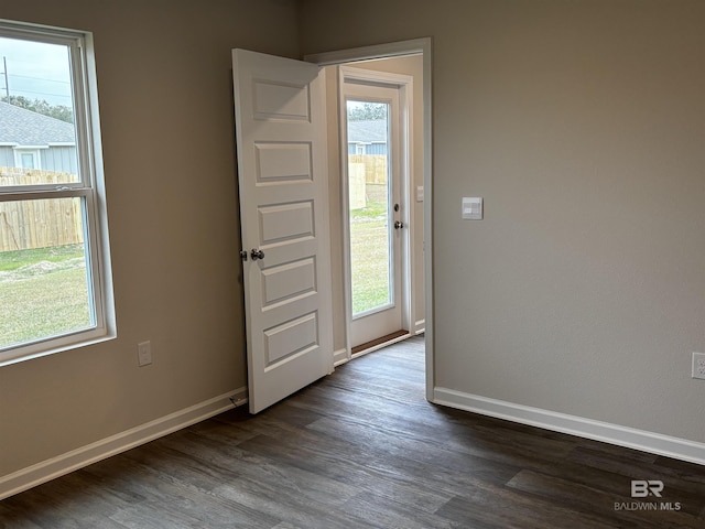 13710 Logan Pl, Foley, AL 36535 - unfurnished room with plenty of natural light, dark wood-style flooring, and baseboards