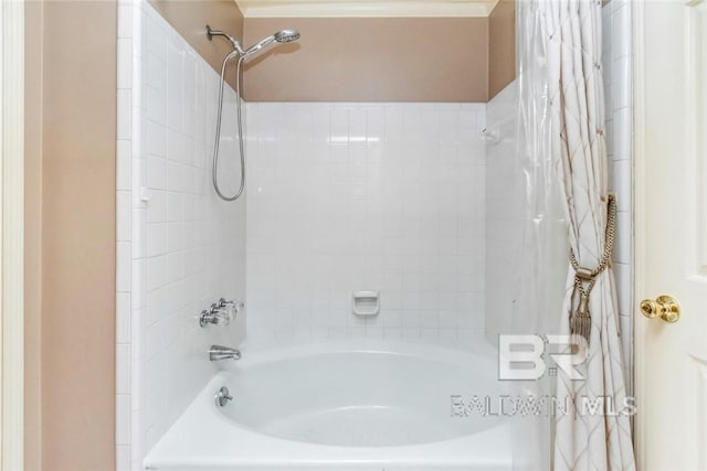 bathroom featuring shower / bath combo with shower curtain