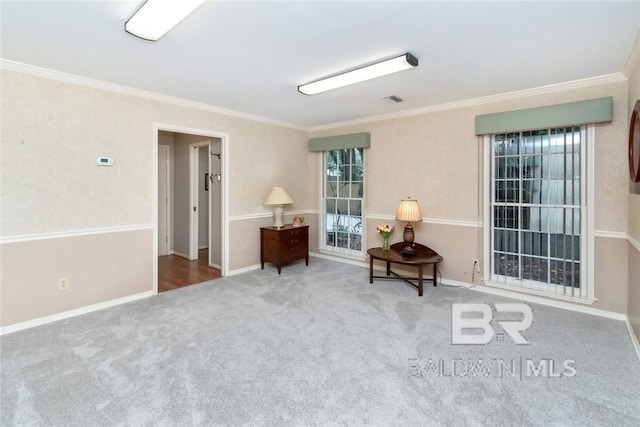 living area featuring carpet floors and ornamental molding