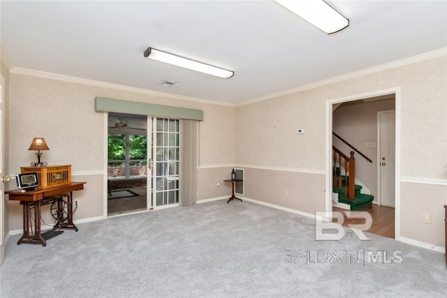 spare room featuring carpet floors and ornamental molding