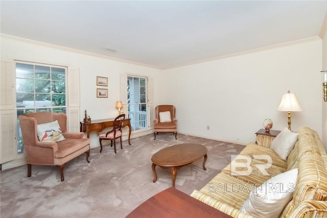 carpeted living room with ornamental molding