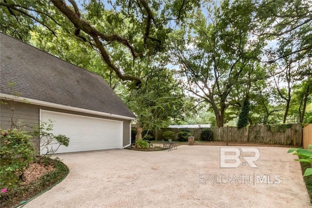 view of patio featuring a garage