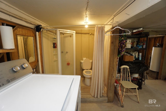 basement with water heater and washer / dryer