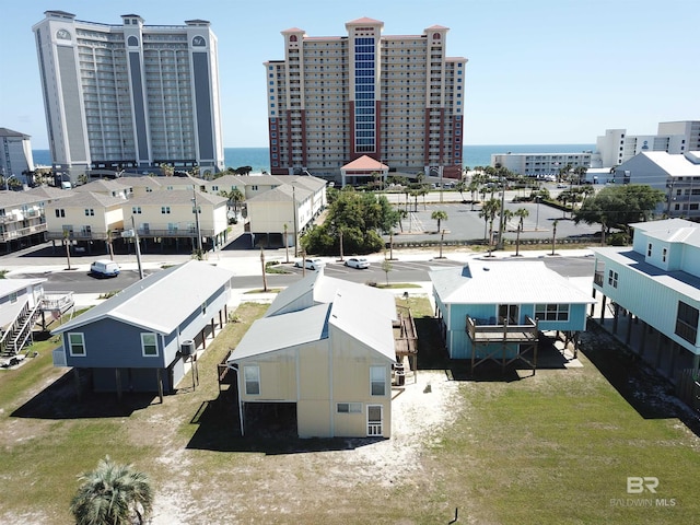 drone / aerial view with a view of city and a water view