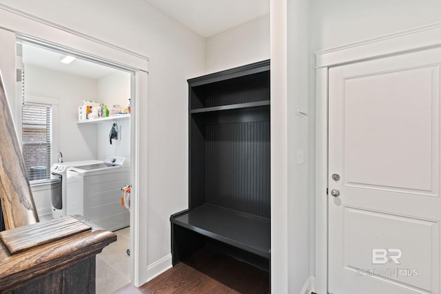 mudroom featuring washer and clothes dryer and wood-type flooring