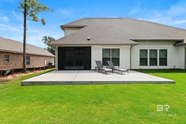 back of property with a patio area, central AC unit, and a yard