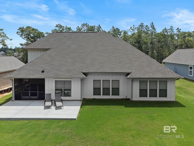 back of property featuring a patio and a lawn