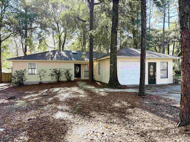 single story home featuring a garage