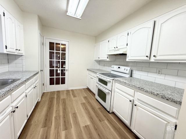 kitchen featuring light stone countertops, tasteful backsplash, electric stove, light hardwood / wood-style flooring, and white cabinetry