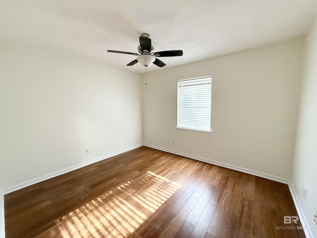 empty room featuring wood-type flooring and ceiling fan