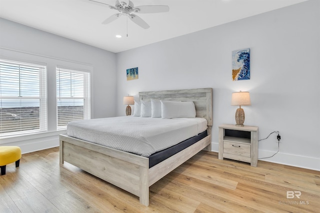 bedroom with light wood-style flooring, baseboards, ceiling fan, and recessed lighting