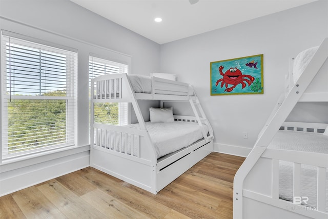 bedroom featuring recessed lighting, light wood-style flooring, and baseboards