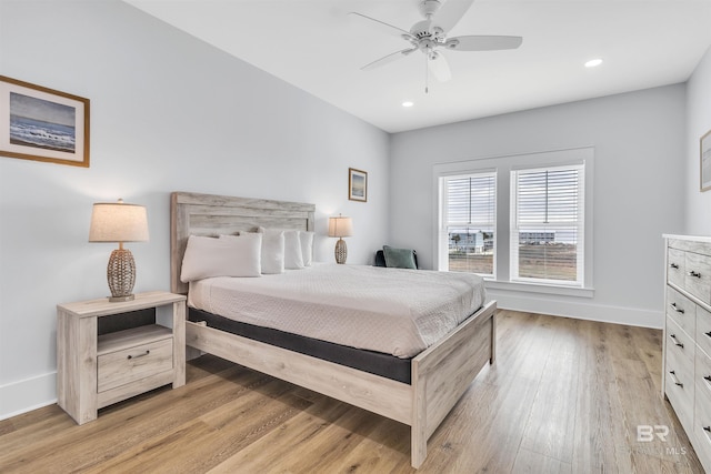 bedroom with light wood-style floors, recessed lighting, ceiling fan, and baseboards
