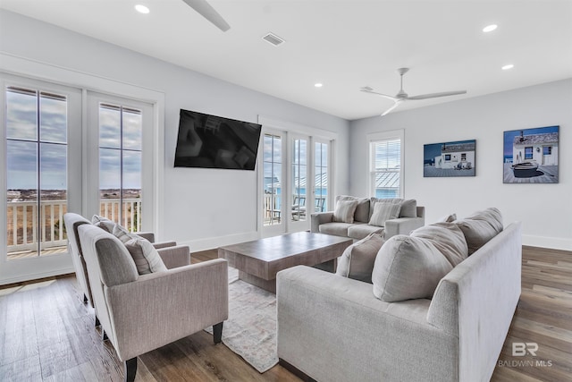 living room with ceiling fan, recessed lighting, wood finished floors, and baseboards