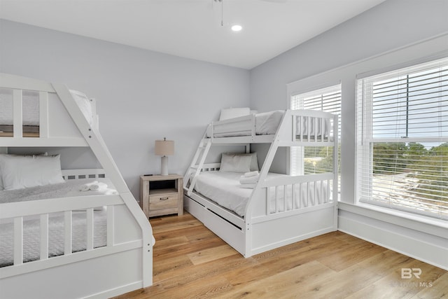bedroom with light wood-style flooring and recessed lighting