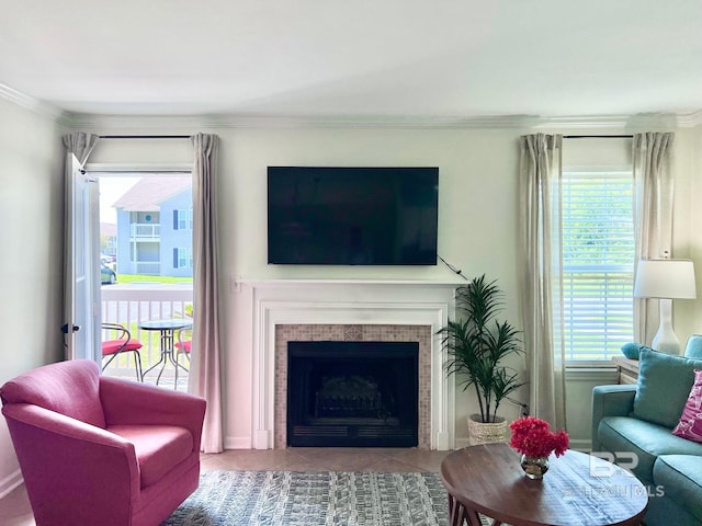 living room with light tile patterned flooring, a fireplace, and ornamental molding