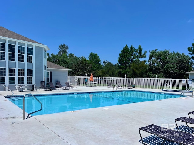 view of swimming pool featuring a patio area