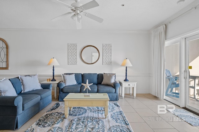 tiled living room with ceiling fan, crown molding, and a textured ceiling