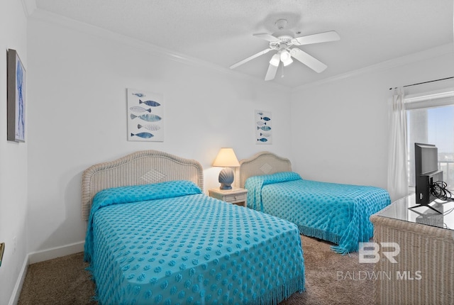 bedroom featuring crown molding, ceiling fan, and dark colored carpet