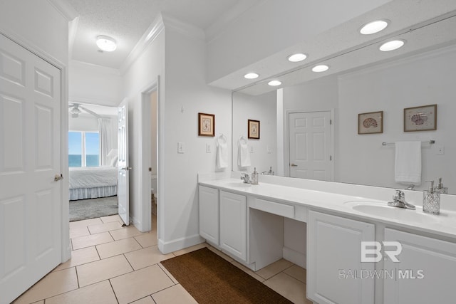 bathroom with ceiling fan, tile floors, and large vanity