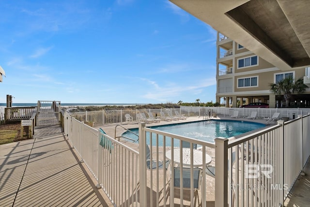 view of swimming pool featuring a patio area