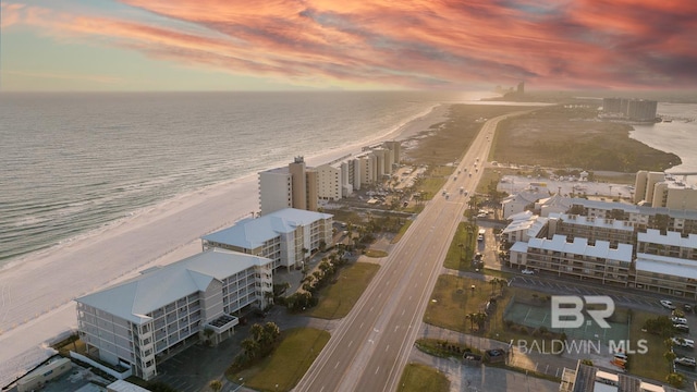 aerial view at dusk with a water view